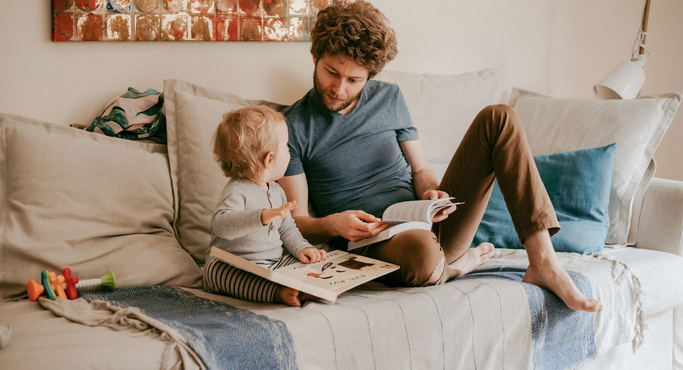 dad and baby reading books 