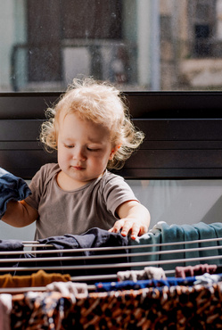 toddler drying clothes