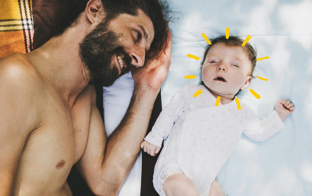 dad lying down beside sleeping baby sunshine