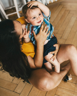 mom playing with baby 