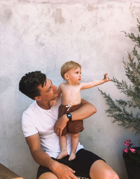 dad holding his kid on lap