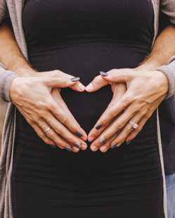 Man hugging his pregnant wife